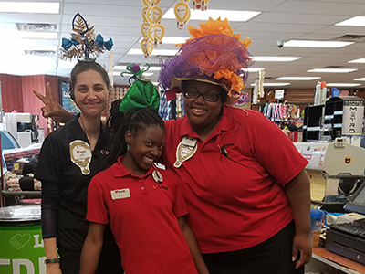 team members with silly hats for fundraiser